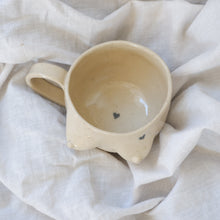 Load image into Gallery viewer, Beige mug with pencil drawn hearts 🖤🖤
