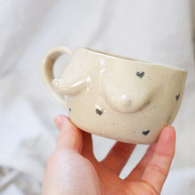Load image into Gallery viewer, Beige mug with pencil drawn hearts 🖤🖤
