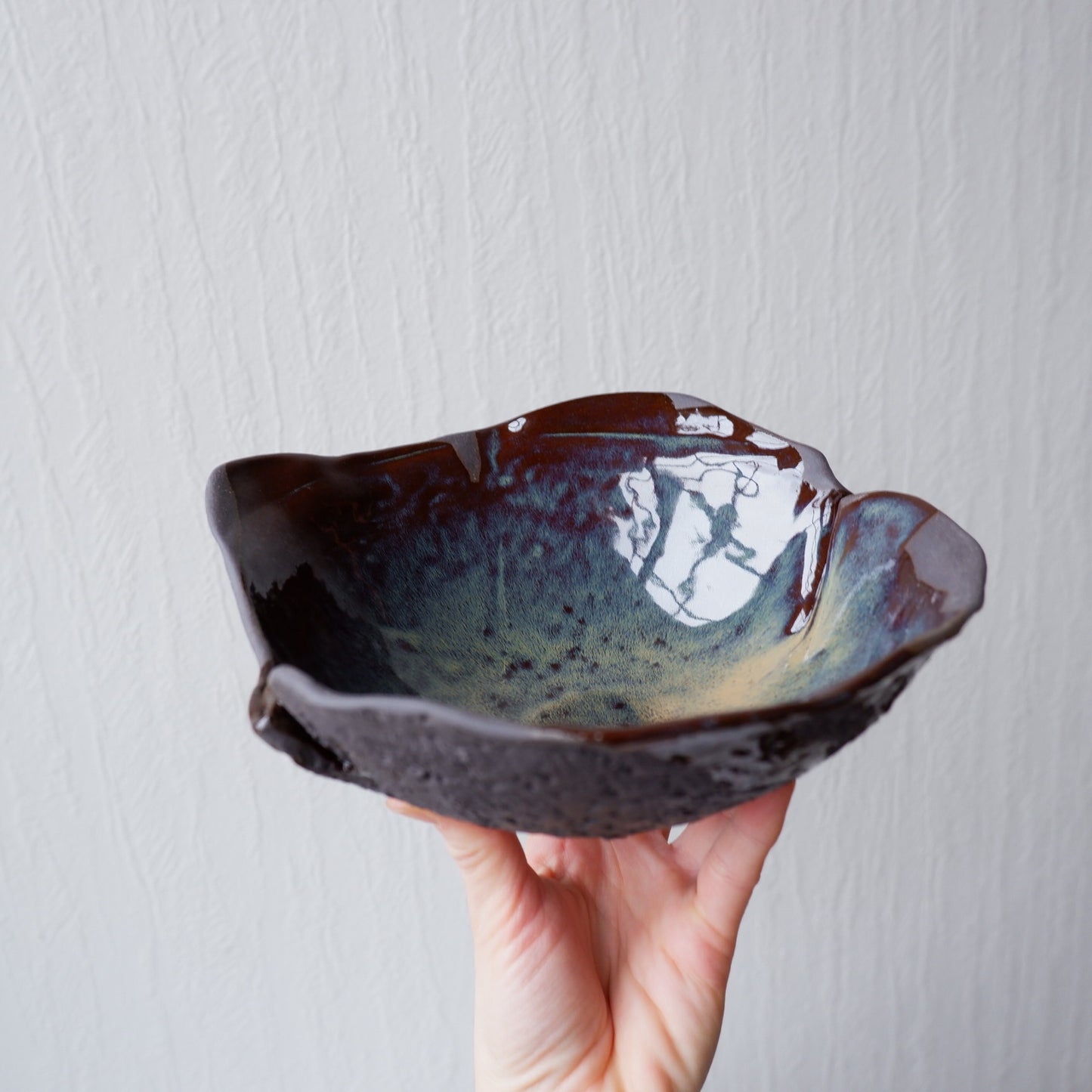 Colorful moon bowl made from black clay