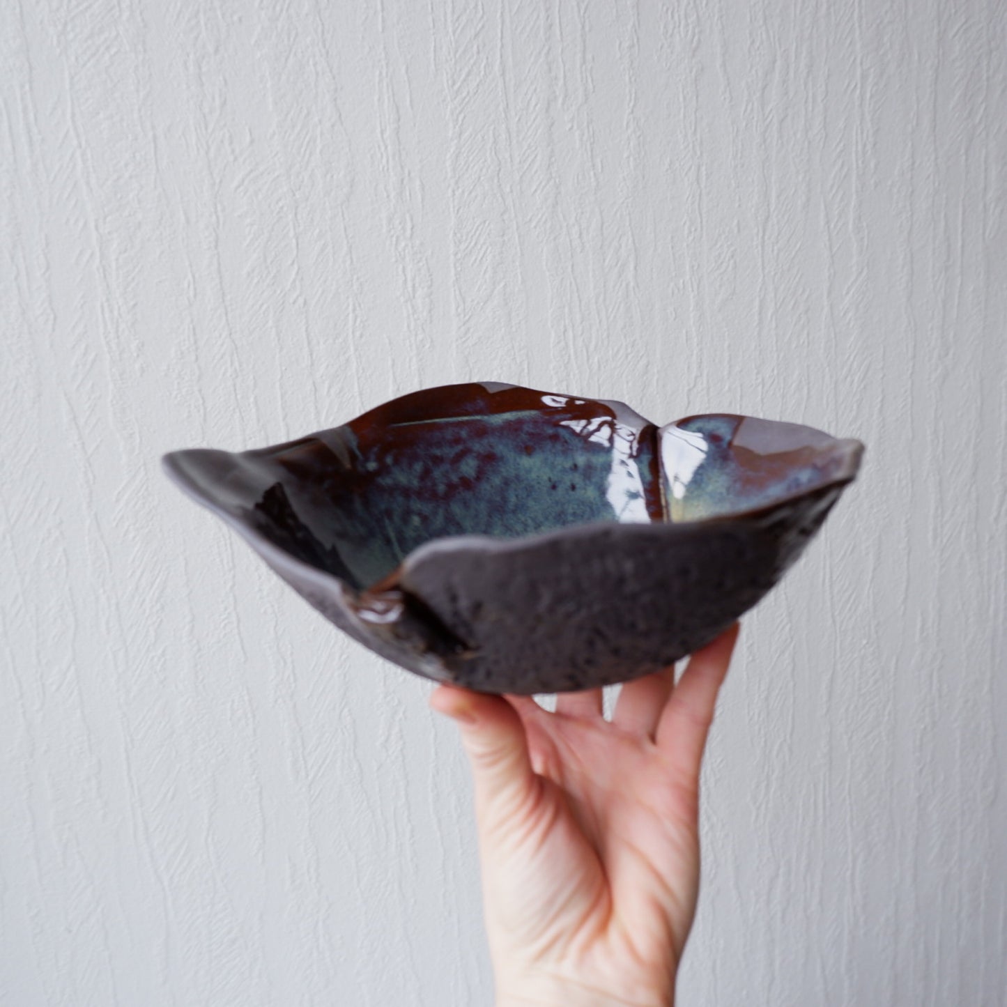 Colorful moon bowl made from black clay