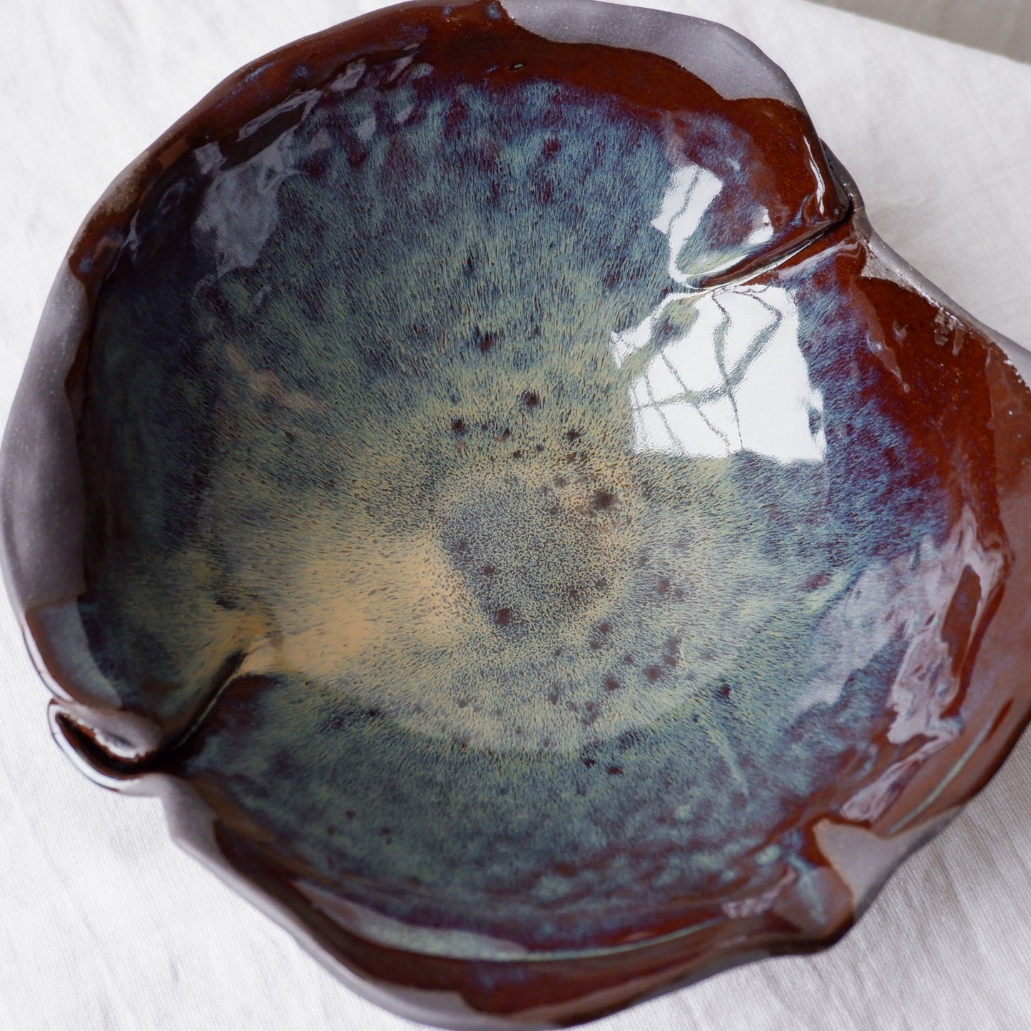 Colorful moon bowl made from black clay