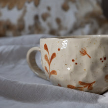 Load image into Gallery viewer, Speckled beige mug with hand-painted brown details
