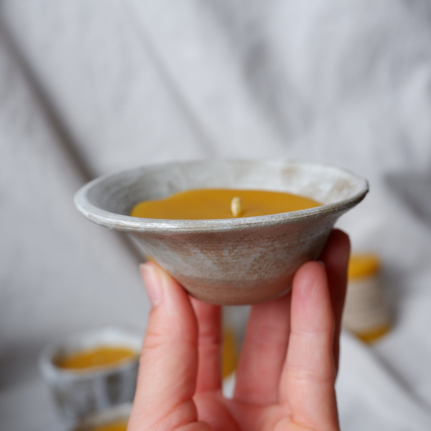 Beeswax candle in handmade ceramics no2