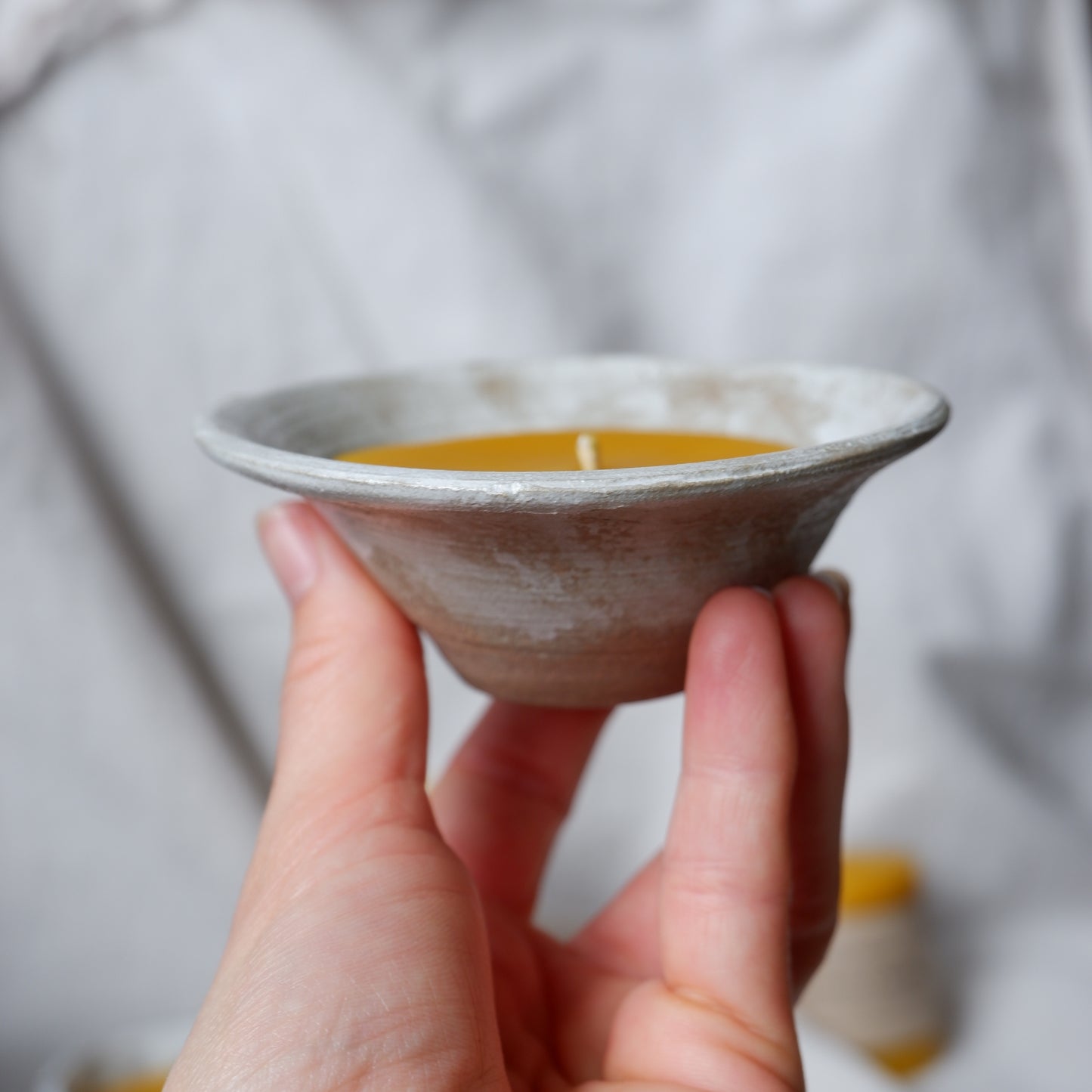 Beeswax candle in handmade ceramics no2