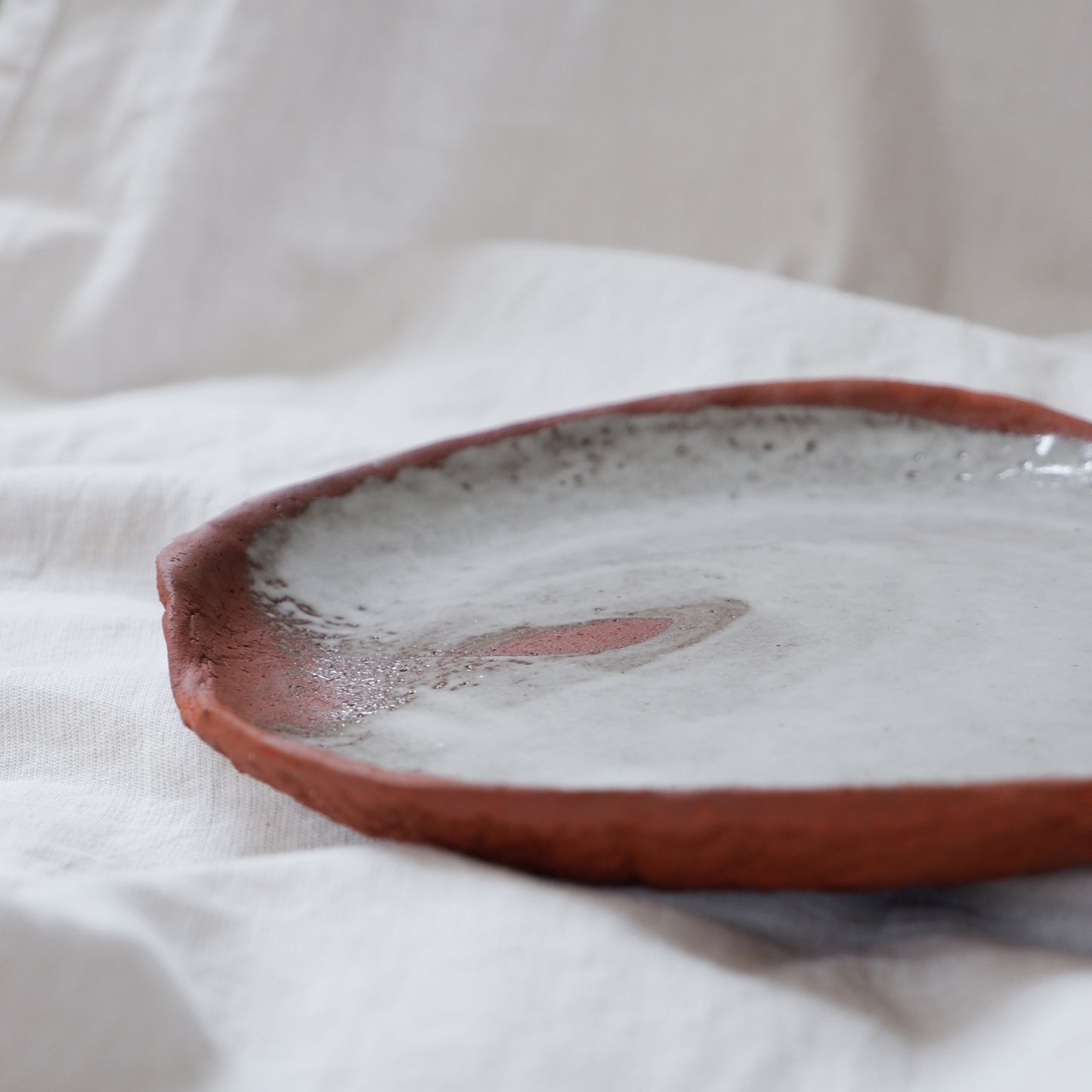 Moon plate made from red clay