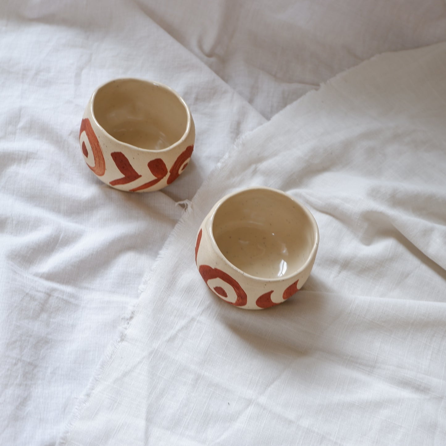 Ceremonial cups with red slip decoration