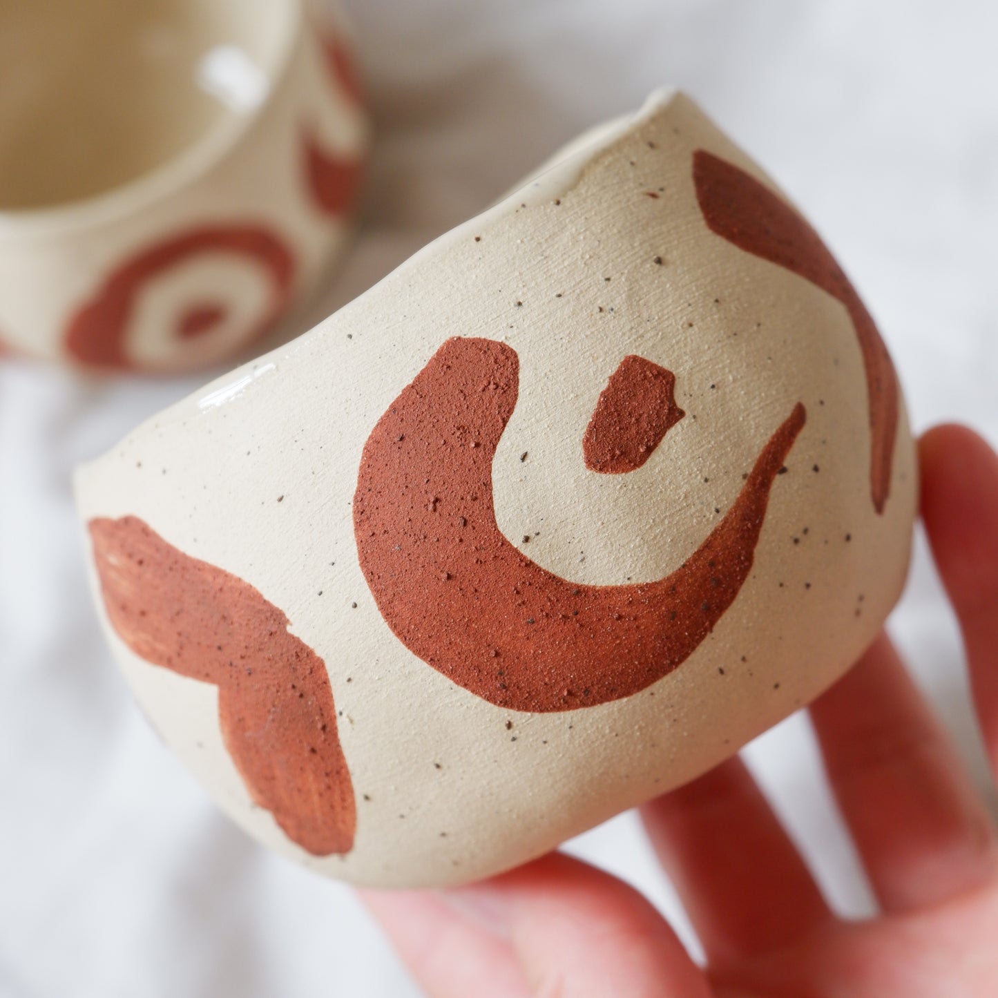 Ceremonial cups with red slip decoration