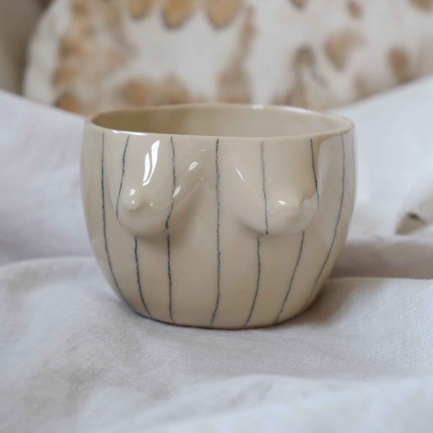 Beige mug with pencil stripes