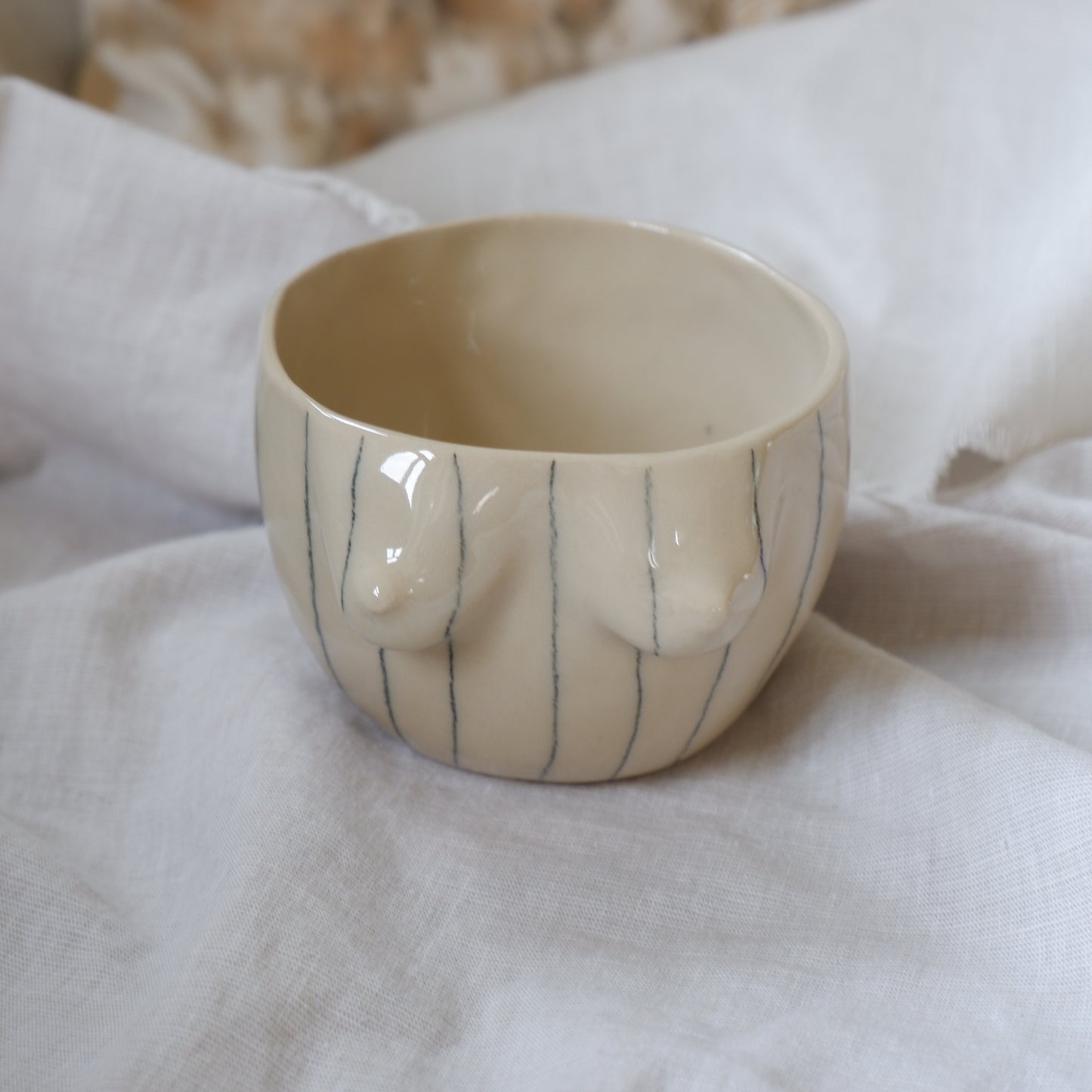 Beige mug with pencil stripes