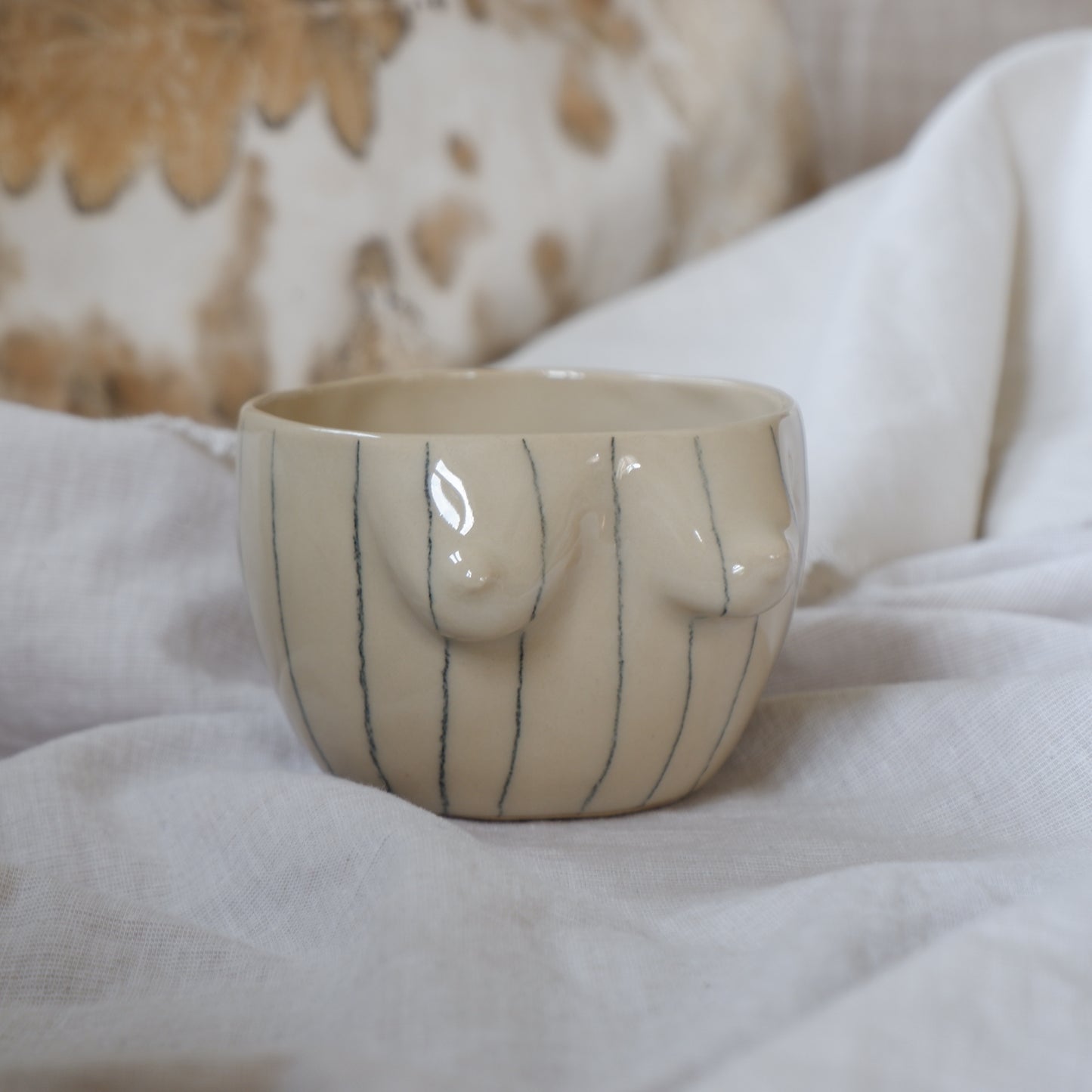 Beige mug with pencil stripes