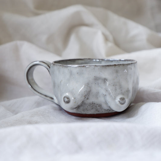 Reddish brown clay mug with white glaze*