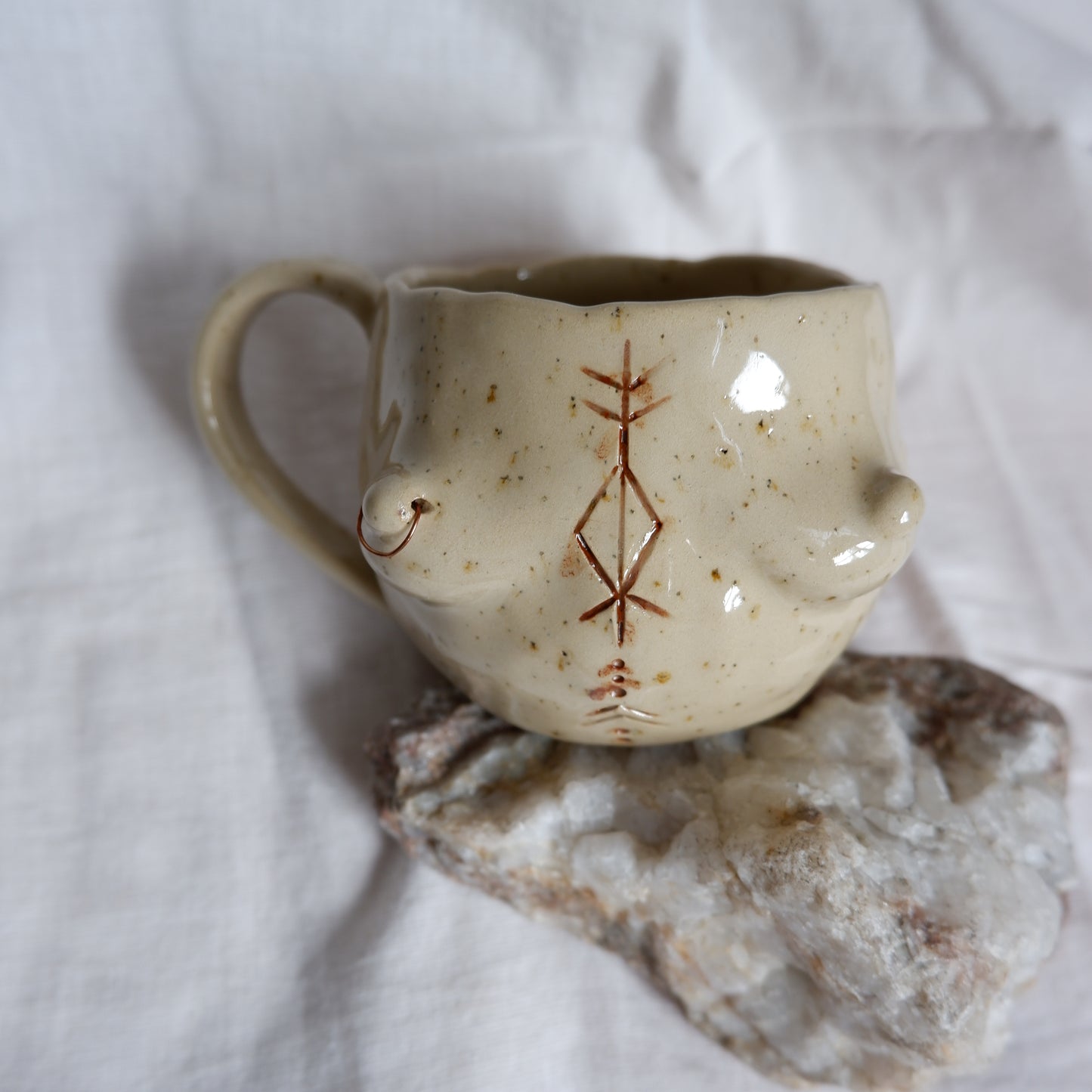Carved tattoo mug with the piercing // symbolizes prosperity, transformation, and purposeful movement