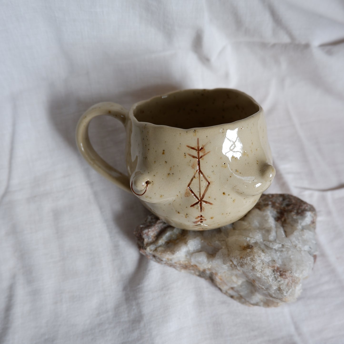 Carved tattoo mug with the piercing // symbolizes prosperity, transformation, and purposeful movement