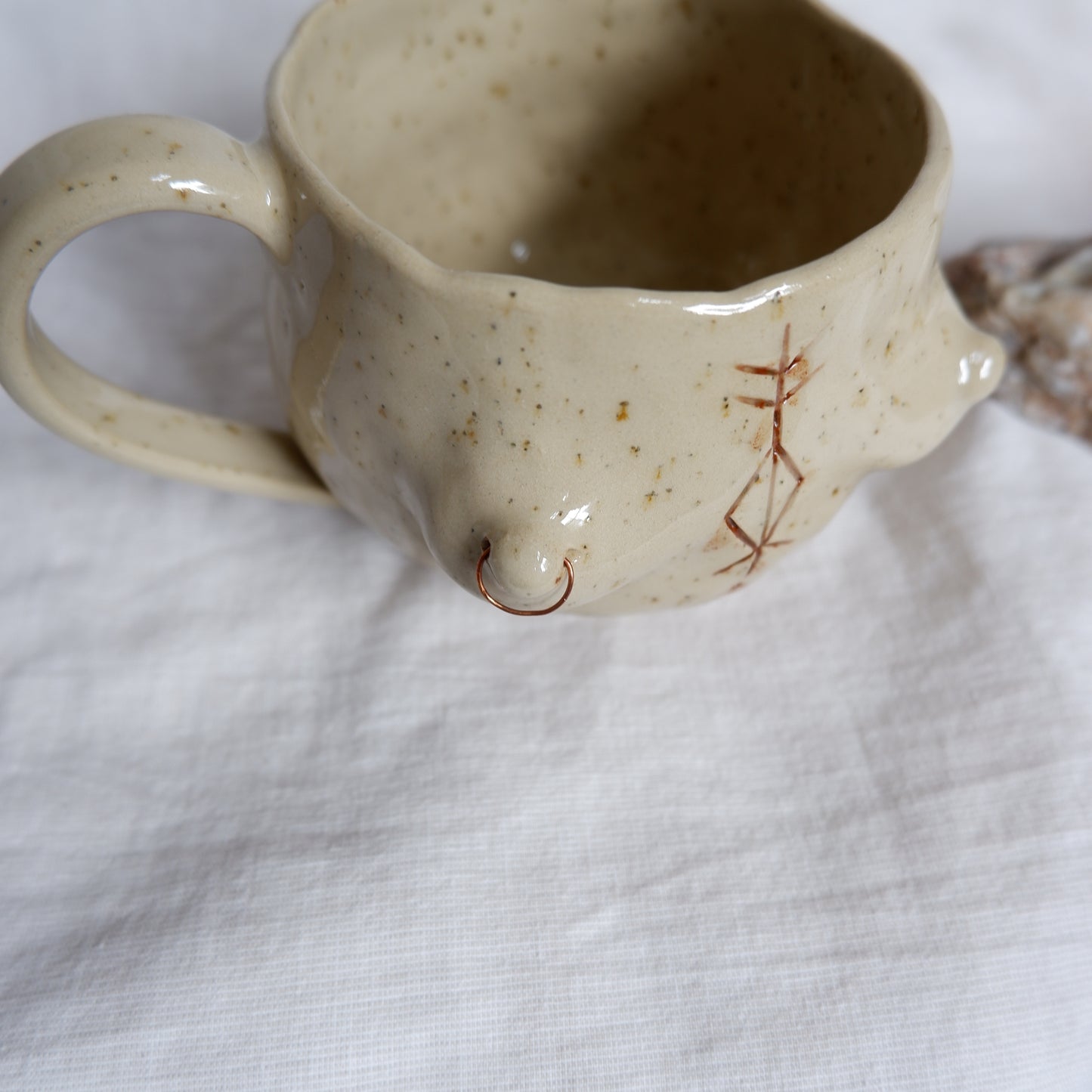 Carved tattoo mug with the piercing // symbolizes prosperity, transformation, and purposeful movement