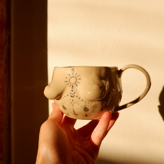 Hand-drawn tattoo mug with a handle