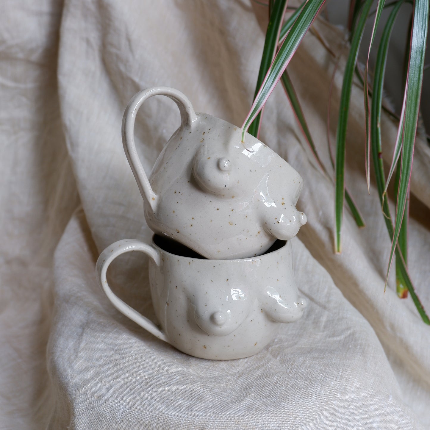Beige mugs with green inside