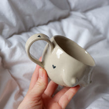 Load image into Gallery viewer, Beige mug with pencil drawn hearts

