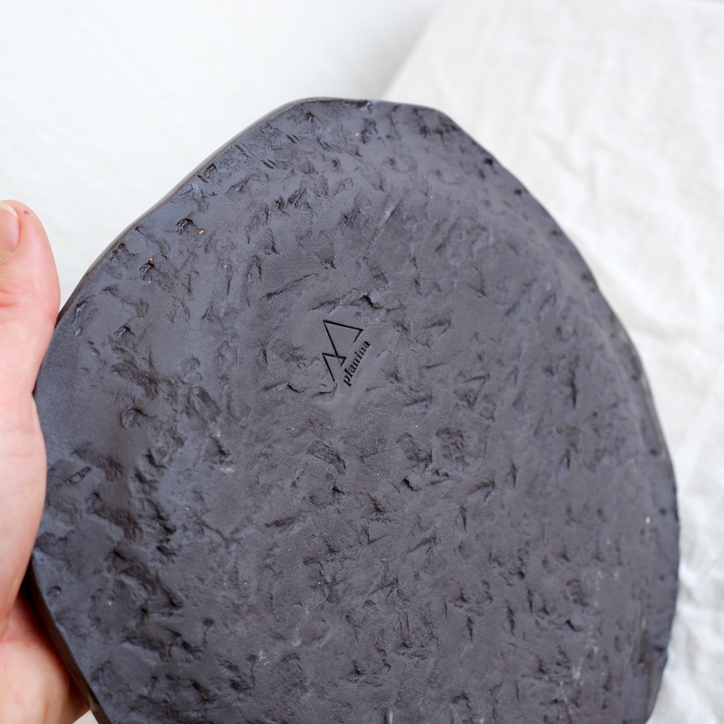 Moon plate made from black clay