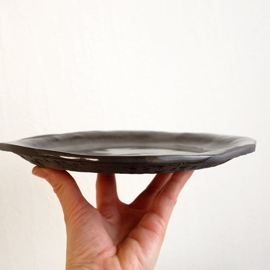 Moon plate made from black clay