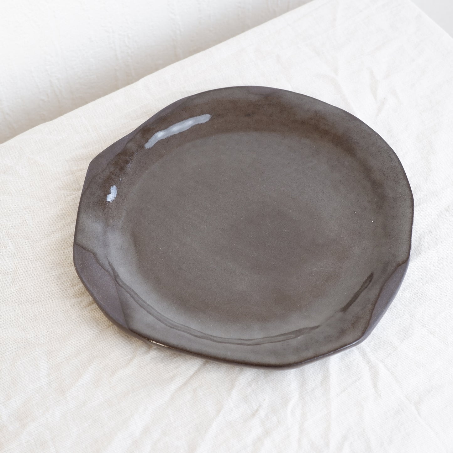 Moon plate made from black clay